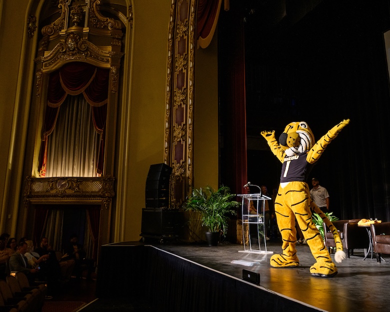 Mizzou's Truman the Tiger mascot preens on stage at the Missouri Theatre. 
