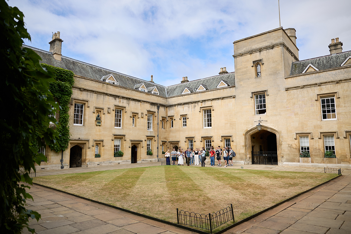 Students standing in awe of an ornate library at University of Oxford