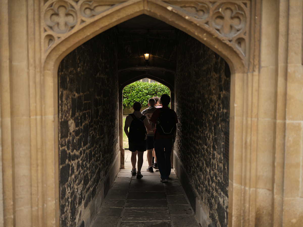 Students walk through a tunnel at Oxford.