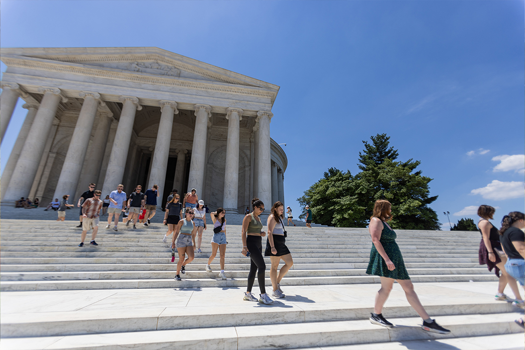 Students walk down the stairs leaving the Jefferson Memorial in Washington, D.C.