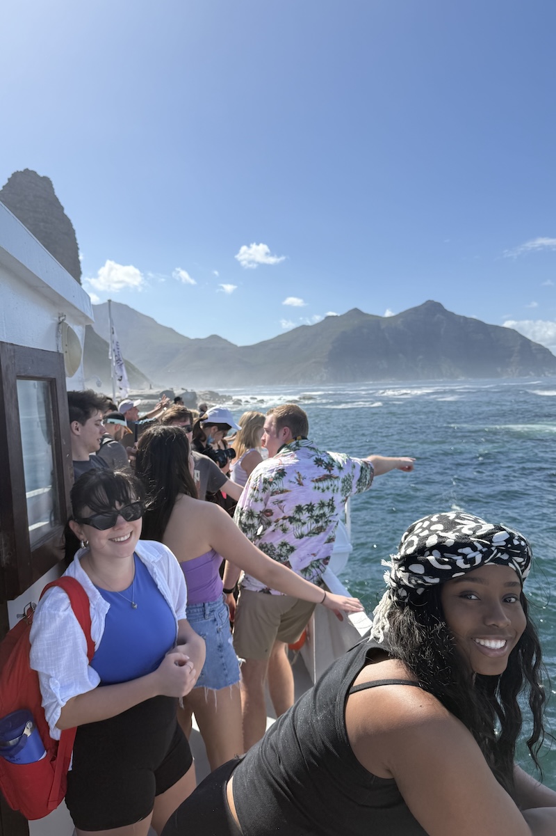 Students smile as their ship approaches Table Mountain.